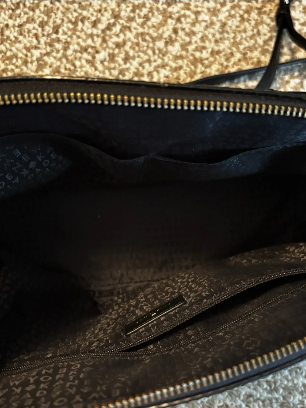 kate spade black leather satchel with gold logo hardware